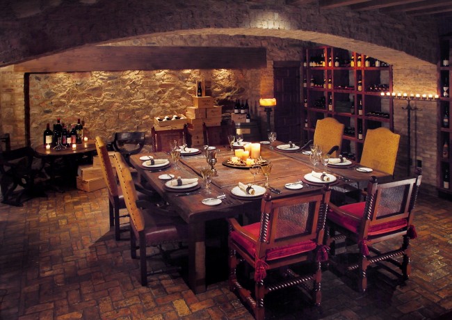 Wine cellar with wooden table & chairs